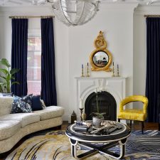 cozy living room with ceiling crown moulding trim and floor carpet