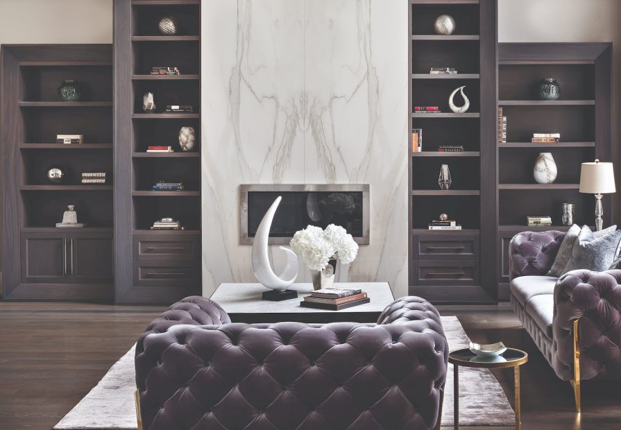 luxury living room with marble wall decor and build in fireplace