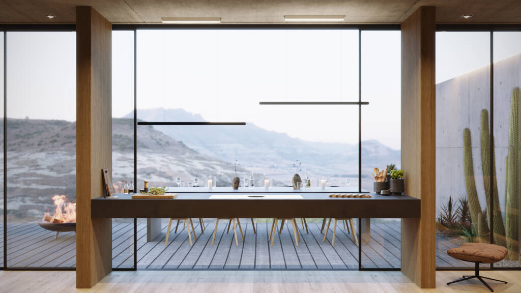 downdraft on a minimalist counter against big glass wall looking at mountains