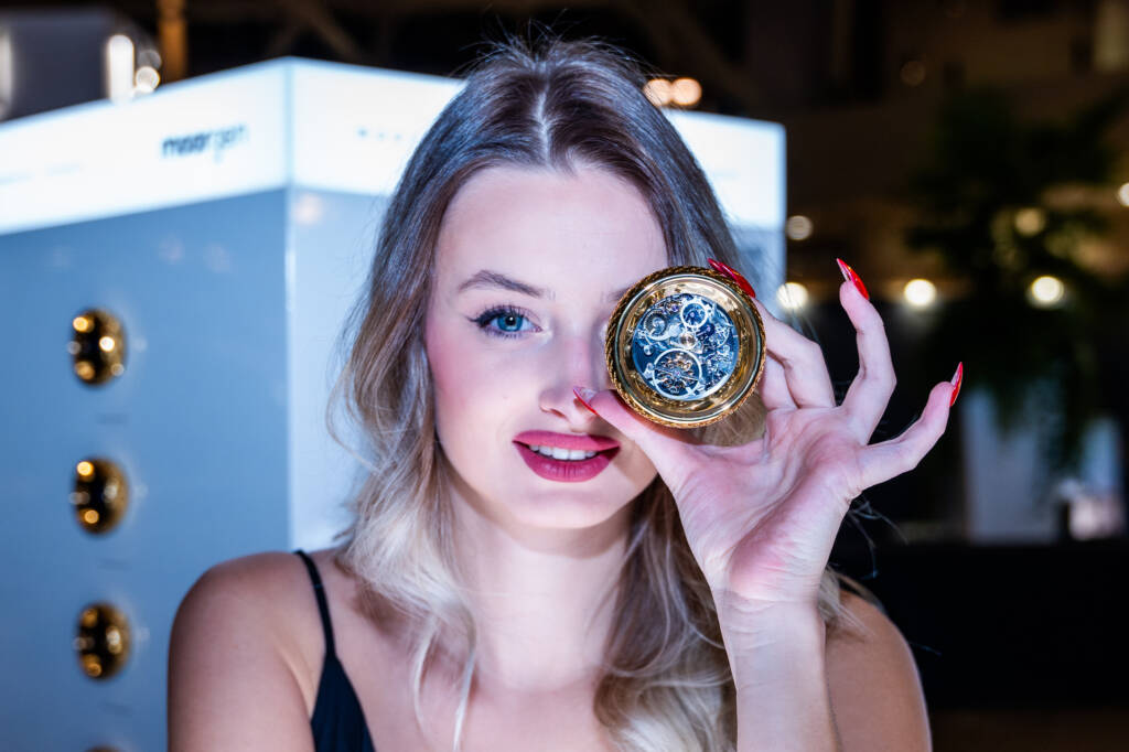 woman smiling holding smart controller covering her left eye