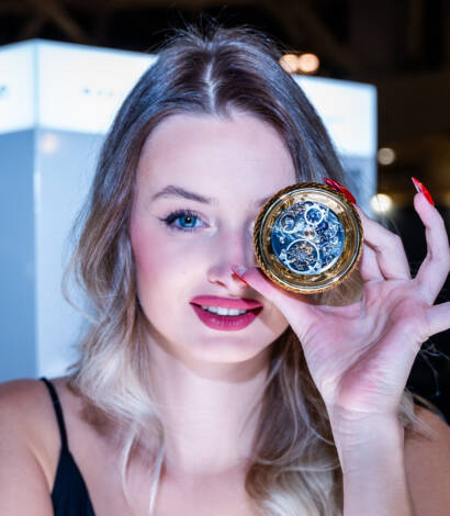 woman smiling holding smart controller covering her left eye