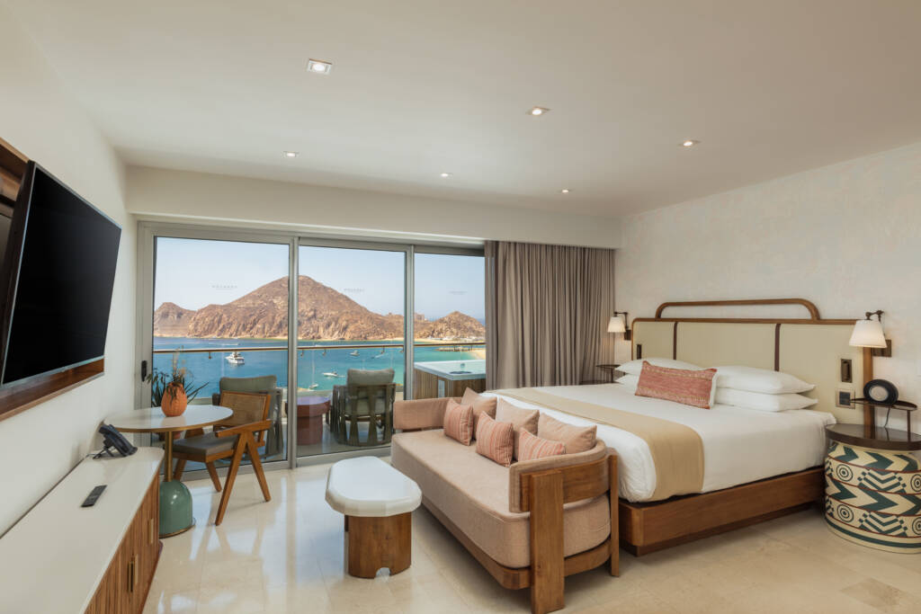 bedroom with king bed, mounted tv and view for the ocean