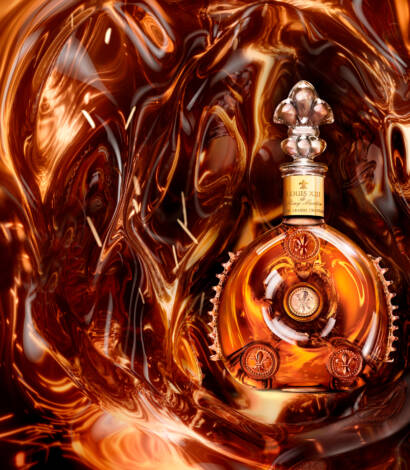 bottle of lotus xiii on a liquid bronze background