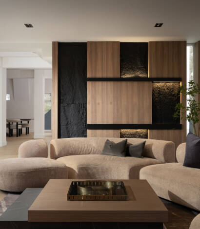 living room with beige sofa and wooden coffee table